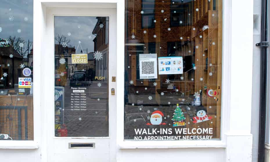 A Christmas display still up in a barber's window in Eton in late March this year