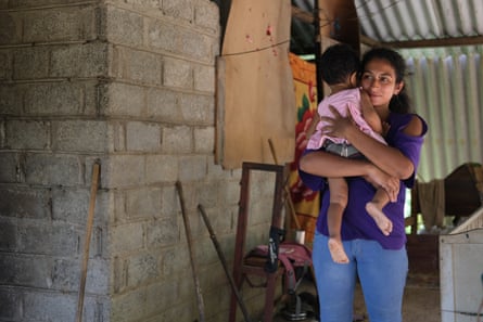 ‘We somehow feed our daughters’: Duleeka Madhunamali, 26, with her 18-month-old.