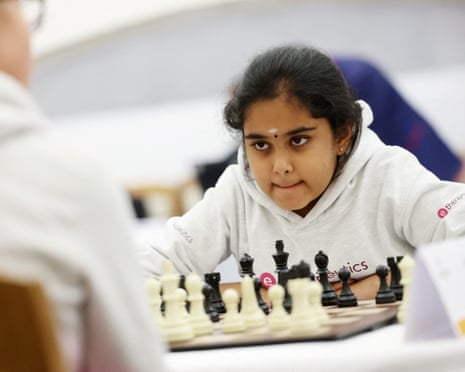 Bodhana Sivanandan looking determined in front of a chessboard