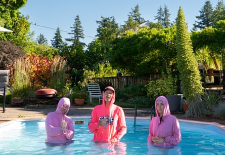 The band Helen standing in a swimming pool, Jed Bindeman, Scott Simmons and Liz Harris