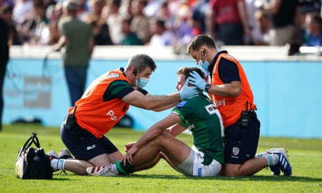 A concussion check is performed on London Irish's Ben White during a Premiership match