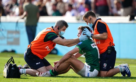 A concussion check is performed on London Irish's Ben White during the Premiership match at the Brentford Community Stadium.