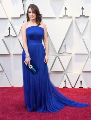 A blue dress in the shade of Democrats, Tina Fey kept it classic for the red carpet. Her sideswept hair and clutch bag added to the look. All the better to let her gags speak for themselves.