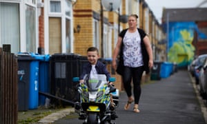Alfie Field riding his new electric police with his mum Gemma as he celebrates his fourth birthday.