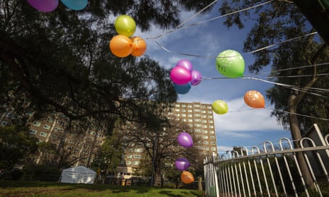 Balloons are seen on the fence at the locked down public housing tower in North Melbourne, Australia.
