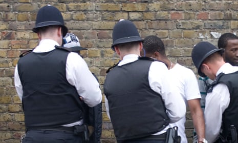 Police stop and search black youths at the entrance to the Notting Hill Carnival in London
