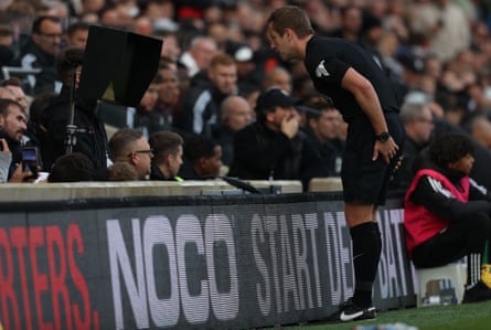 John Brooks, the referee, goes to the monitor during Manchester United’s 1-0 win against Fulham on Saturday