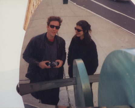 Selfie of a man and woman wearing sunglasses in a mirror