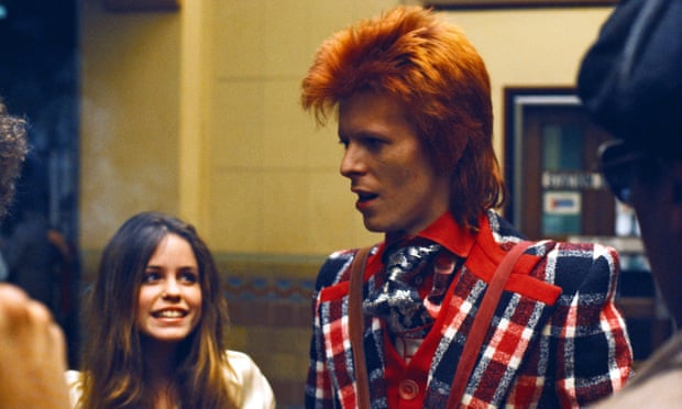 David Bowie pictured with a fan in the 1970s, in his Ziggy Stardust phase.