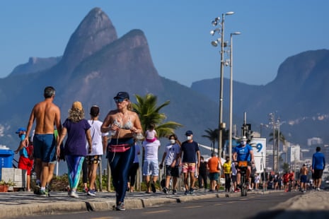 People enjoy the weather at Ipanema beach on 5 July 2020 in Rio de Janeiro, Brazil, on the first Sunday since the mayor has lifted most of the coronavirus restrictions.