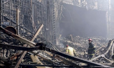 Russian rescuers clear the rubble and extinguish fires at Moscow's Crocus City Hall.