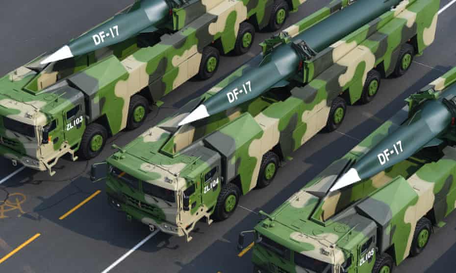 Military vehicles carrying the DF-17 hypersonic ballistic missile roll past Tiananmen Square during a parade in Beijing in October 2019.
