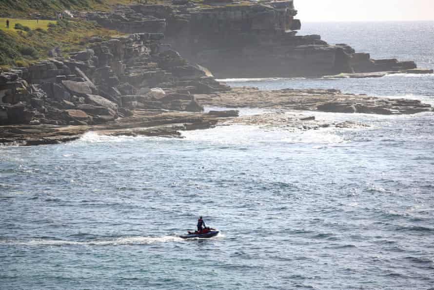 Authorities conduct a search of Little Bay and surrounding coastline after a shark attack claimed the life of a swimmer.