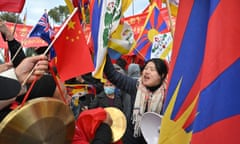 Pro-China supporters and anti-China protesters outside  Parliament House in Canberra on Monday