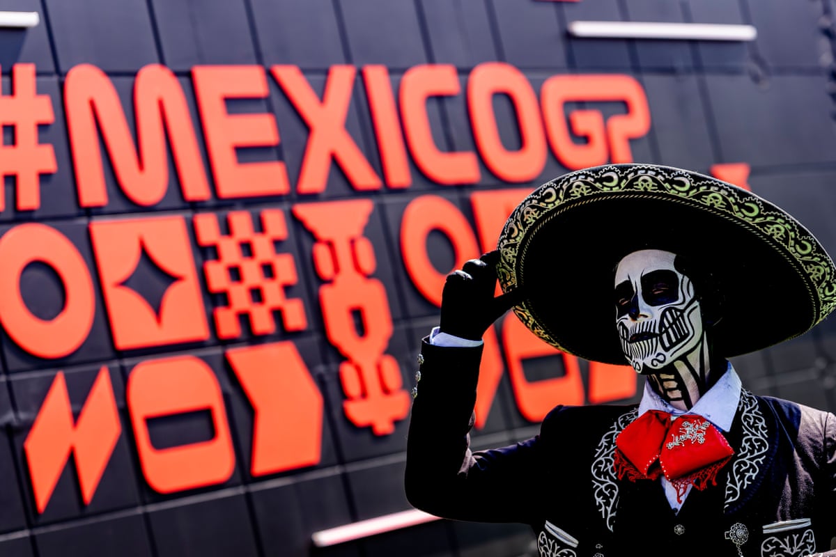 A person dresses up as a skeleton for Day of the Dead