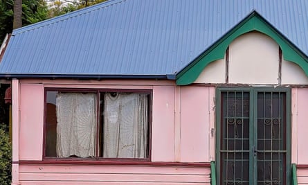 Pink abandoned house with smashed windows