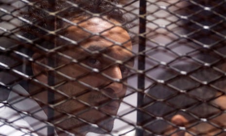 Egyptian photojournalist Mahmoud Abu Zeid, better known as Shawkan, at his trial in Cairo