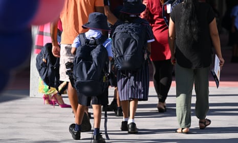 Students walk to school with parents