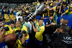 Richarlison lifts the trophy after Brazil beat Peru to win the 2019 Copa América.