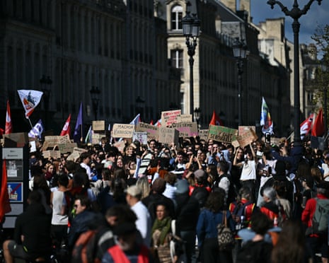 Protesters hold placard as they march during a demonstration of high-school students in Bordeaux.
