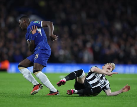 Newcastle’s Anthony Gordon (right) goes down following a challenge by Moises Caicedo of Chelsea.