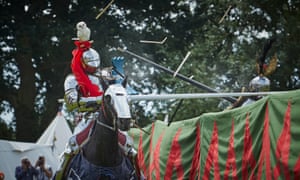 Knights on horseback taking part in a medieval jousting tournament