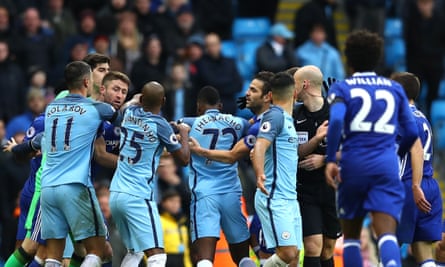 Players square up to each other after Sergio Agüero’s foul on David Luiz, which led to a red card for the Manchester City striker followed by one for Fernandinho.