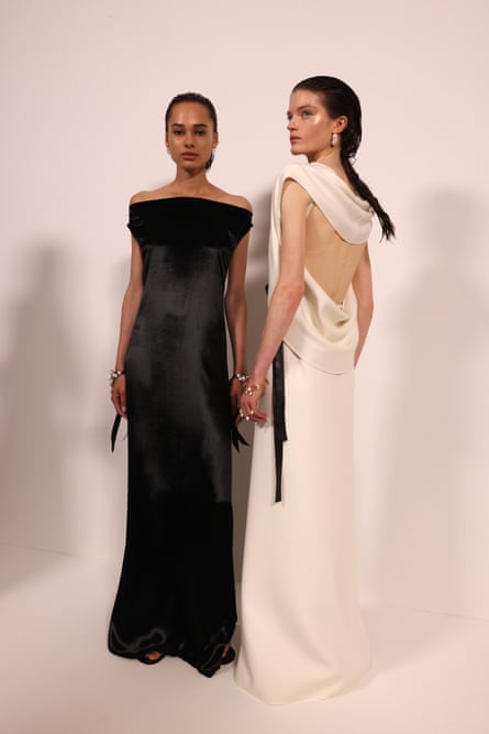Two models wearing evening gowns
