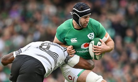 Ireland’s Caelan Doris breaks done a tackle against Fiji