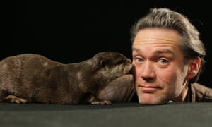 Charlie Hamilton James, presenter of Natural World: Supercharged Otters, and Rudi the otter.