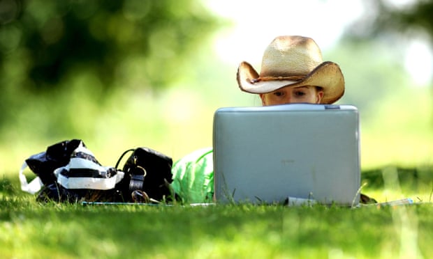 A woman uses a laptop on a hot day