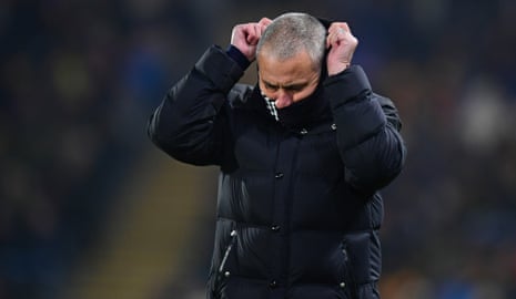Jose Mourinho adjusts his snood on a cold night in Hull.