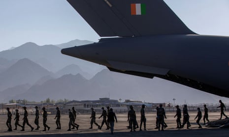 Indian soldiers disembark from a military transport plane at a forward airbase in Leh, Ladakh.