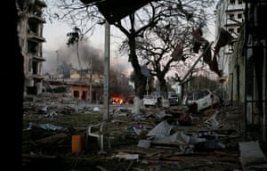 The aftermath of a suicide car bomb attack outside the Ambassador Hotel in Mogadishu