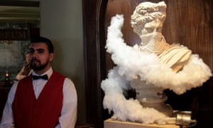 A bust wreathed in clouds of gas from a tear gas canister.