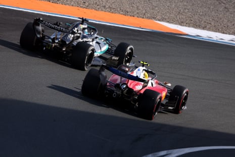 George Russell fends off Lewis Hamilton.