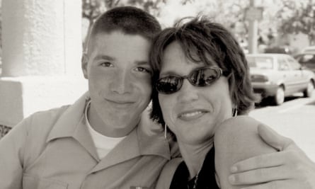 young man with arm around woman