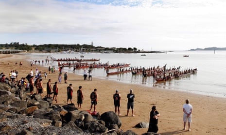Some of the Nineteen Maori Waka line the beach in the early morning ahead of the Waitangi celebrations, Waitangi, Bay of Islands, New Zealand.