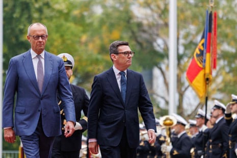 German chancellor Friedrich Merz marches with prime minister of the United Kingdom, Andy Burnham as the honour guard performs military honours at the Federal Chancellery following his arrival in Berlin, Germany.