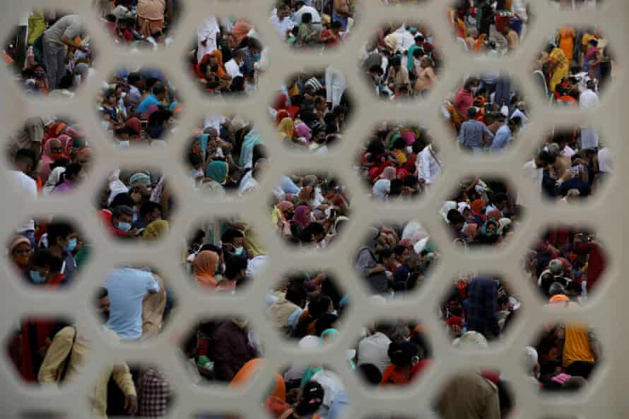 Devotees gather for evening prayer on the banks of the Ganges during Kumbh Mela, 13 April