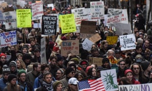 People participate in a protest against President Donald Trump’s travel ban in New York City.
