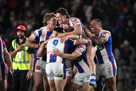 Newcastle Knights players celebrate winning the semi-final match in Auckland.