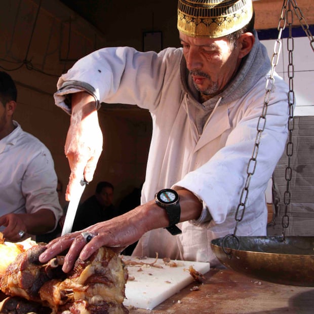 Chef at work carving meat at Chez Lamine, Marrakech, Morocco.
