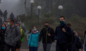 People wear masks in Warsaw as infections rise in Poland.