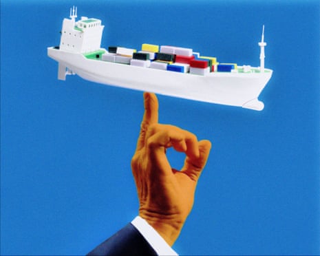 an orange hand balancing a cargo ship on the tip of the finger