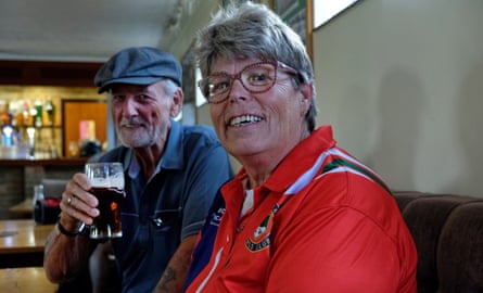 Bruce Townsend, holding a beer, and Patricia Gordon sitting in the bar at the bowls club
