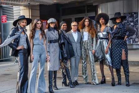 Tommy Hilfiger and Zendaya are flanked by models including Winnie Harlow, Halima Aden and Ebonee Davis outside the Apollo.