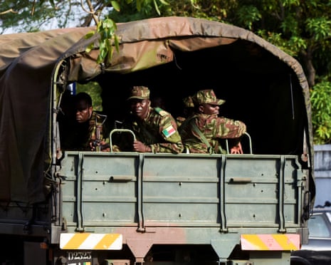 Soldiers patrol the streets of Benin.