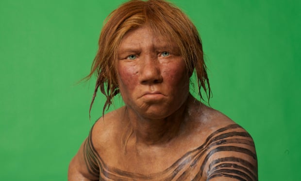 Head and shoulders of a sculpted model of a female Neanderthal.