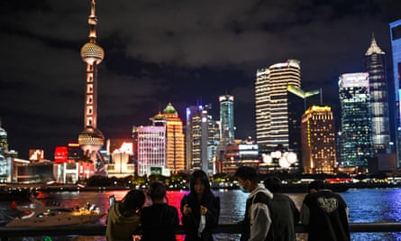 People visit the Bund promenade in Shanghai
